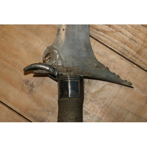 1554 - Malaysian kris with typical ornate flamberge blade, white metal wire bound grip and treen birds head... 