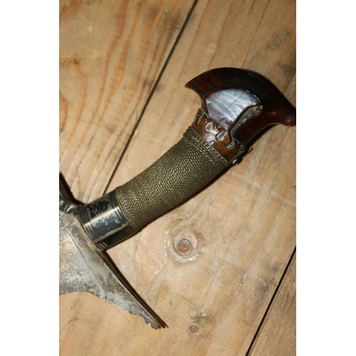 1554 - Malaysian kris with typical ornate flamberge blade, white metal wire bound grip and treen birds head... 