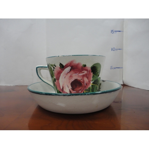 12 - Group of Wemyss pottery to include a lidded preserve pot, tea cup and saucer, egg cup, strainer and ... 