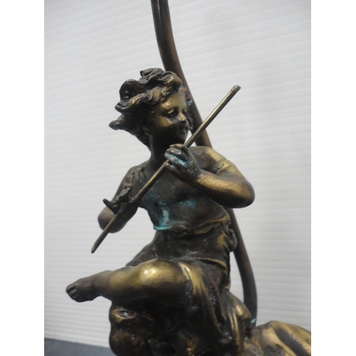 24 - After the OriginalBronzed metal figural table lamp in the form of classical musical figures playing ... 