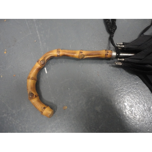 26 - Parasol with bamboo handle.
