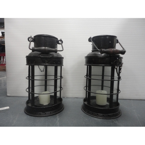 30 - Two cylindrical painted iron carriage lamps and another of square form.&nbsp; (3)