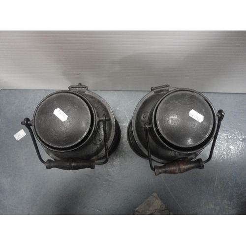 30 - Two cylindrical painted iron carriage lamps and another of square form.&nbsp; (3)