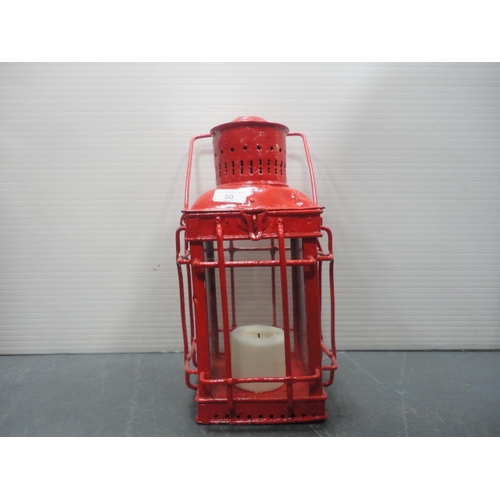 30 - Two cylindrical painted iron carriage lamps and another of square form.&nbsp; (3)