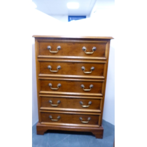 Modern yew wood chest of five drawers.