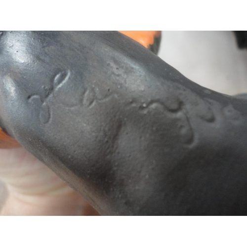 52 - Group of Chinese-style water buffalo figures, a Beneagles whisky bottle in the form of a seal etc.