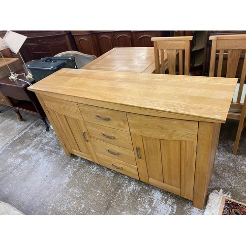 618 - Contemporary oak four drawer, two cupboard sideboard, 88 x 160 x 45 cm