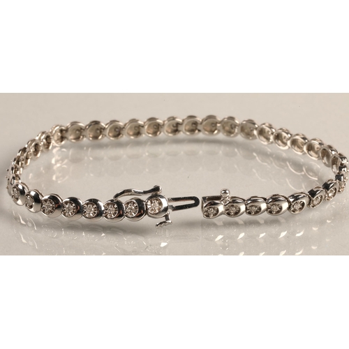 63 - 9ct white gold diamond set tennis bracelet, 18cm long, total weight 10.8g