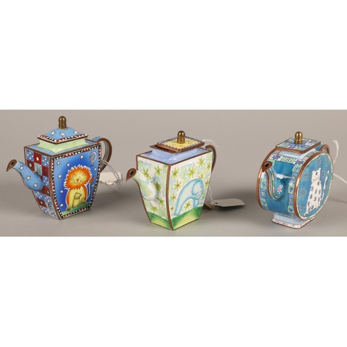 Three Charlotte di Vita enamelled copper tea pots, cased numbered