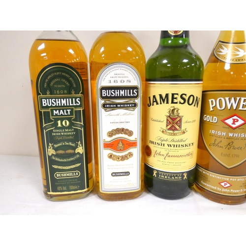 63 - Five bottles of Irish whisky including two bottles of BUSHMILLS Malt 10 year old single malt whiskey... 