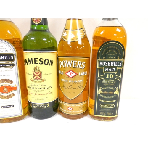 63 - Five bottles of Irish whisky including two bottles of BUSHMILLS Malt 10 year old single malt whiskey... 