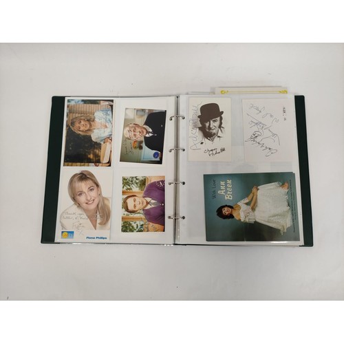 476 - A well filled celebrity autograph album with examples from Chris De Burg, Philip Scofield, Leslie As... 