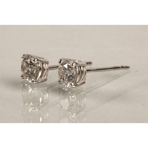 96A - Pair of ladies 18ct white gold diamond stud earrings, each stone approximately 0.6 carat.