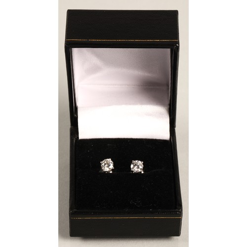 96A - Pair of ladies 18ct white gold diamond stud earrings, each stone approximately 0.6 carat.