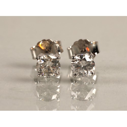 96A - Pair of ladies 18ct white gold diamond stud earrings, each stone approximately 0.6 carat.