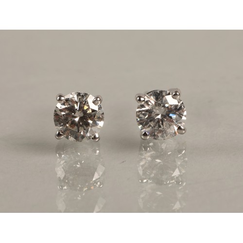 96A - Pair of ladies 18ct white gold diamond stud earrings, each stone approximately 0.6 carat.