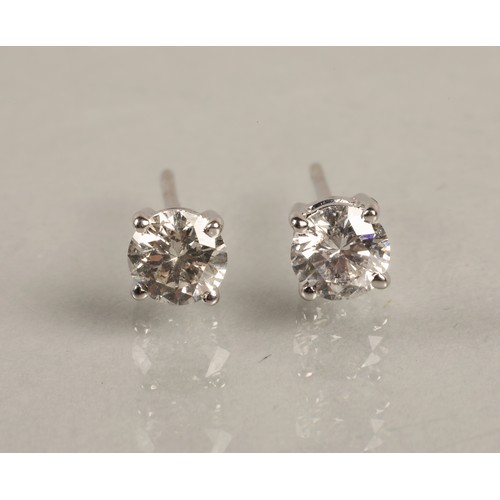 96A - Pair of ladies 18ct white gold diamond stud earrings, each stone approximately 0.6 carat.