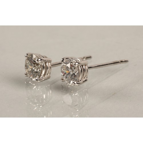 96A - Pair of ladies 18ct white gold diamond stud earrings, each stone approximately 0.6 carat.