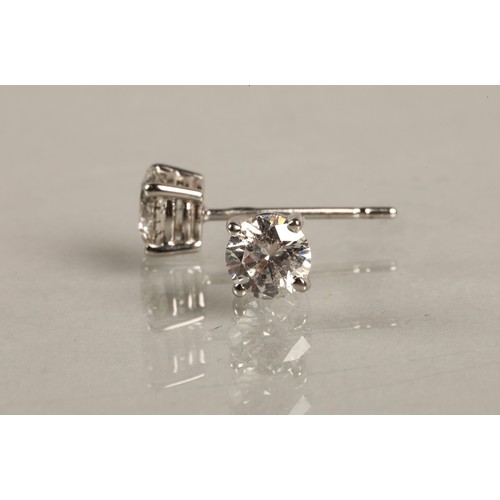 96A - Pair of ladies 18ct white gold diamond stud earrings, each stone approximately 0.6 carat.