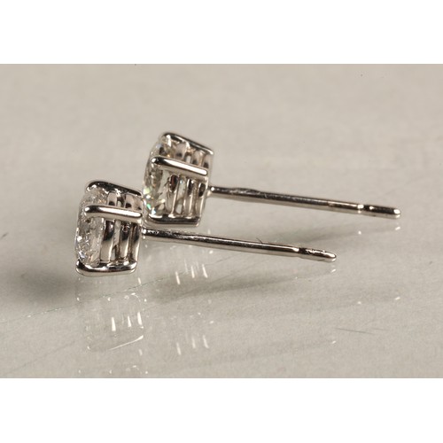 96A - Pair of ladies 18ct white gold diamond stud earrings, each stone approximately 0.6 carat.