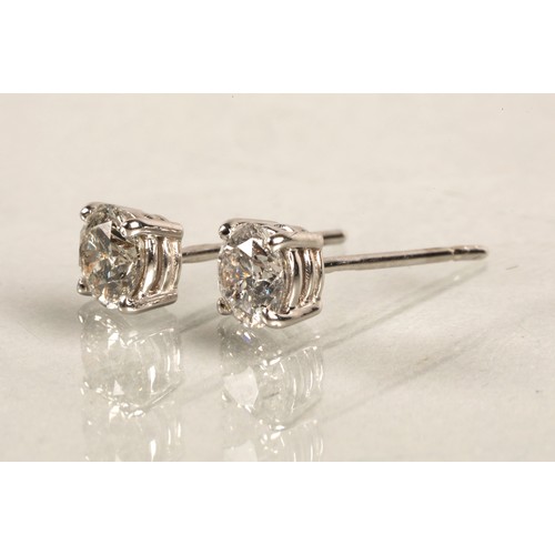 96A - Pair of ladies 18ct white gold diamond stud earrings, each stone approximately 0.6 carat.