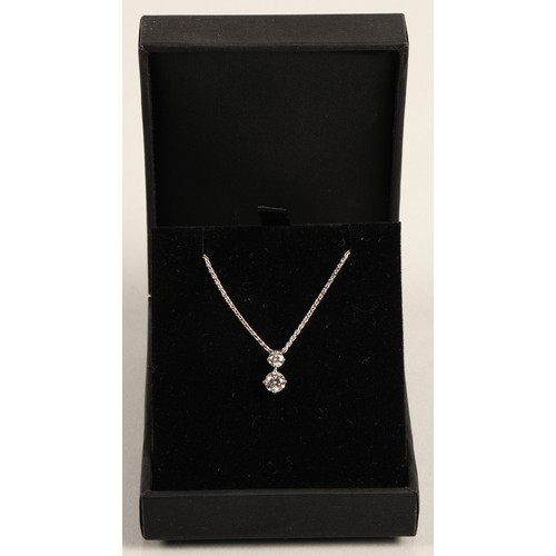 97A - Ladies two stone diamond pendant mounted on an 18ct white gold chain. stone one 0.5 carat, stone two... 