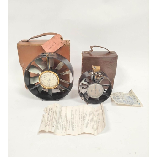 469 - Two early 20th century air speed meters in leather cases the smallest measuring 10cm in diameter and... 