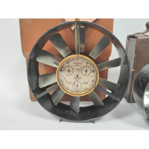 469 - Two early 20th century air speed meters in leather cases the smallest measuring 10cm in diameter and... 