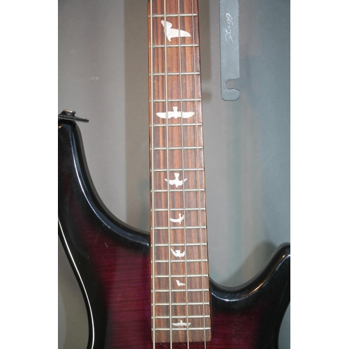 40 - Lindo four string electric bass guitar with dark purple body and bird design finger board, 110cm tal... 