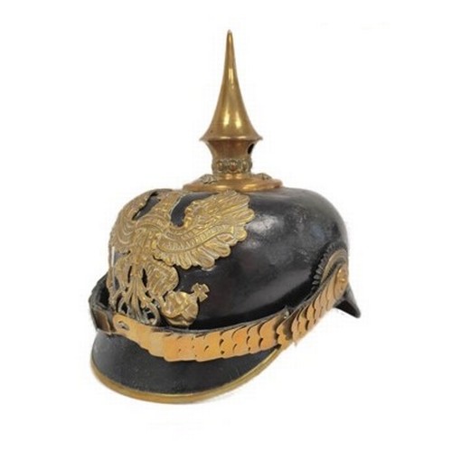 Imperial German Pickelhaube spiked officer's helmet model 1897. The helmet of black leather construction is adorned with central brass helmet plate above articulated chin-scales, the spiked finial detachable via screw thread. Height approximately 24cm