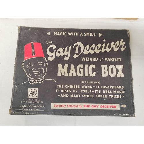 140 - Large box of assorted magic tricks to include Gay Deceiver Magic Box, a partial Ernest Sewell Cabine... 