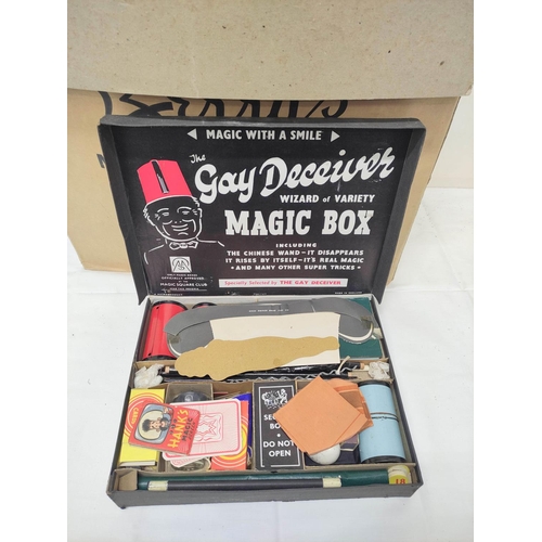 140 - Large box of assorted magic tricks to include Gay Deceiver Magic Box, a partial Ernest Sewell Cabine... 