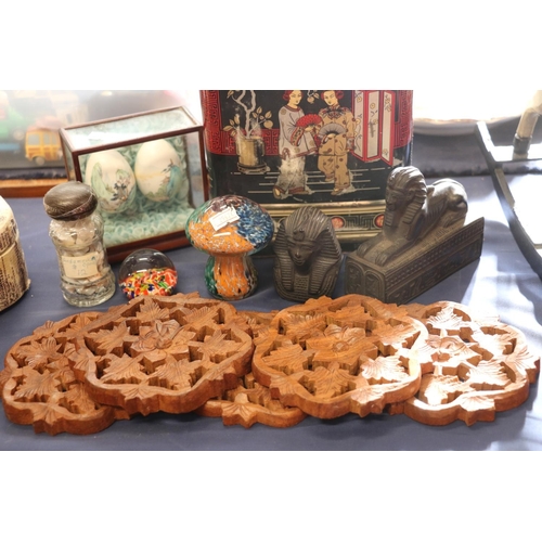 57 - Carved wooden coasters, Chinese painted eggs, glass paperweights, a chinoiserie decorated biscuit ti... 