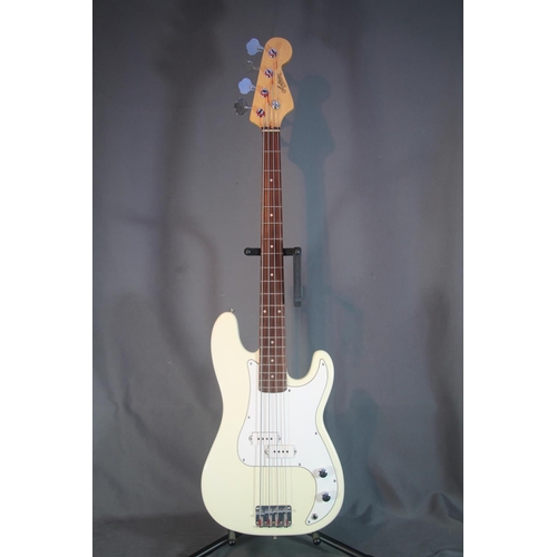 Artisan four string bass guitar with cream and white body in soft