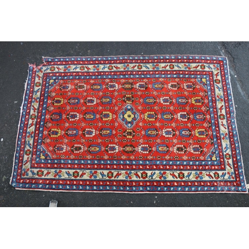 694 - Persian Kilim style rug, repeating geometric motifs on a red background within cream border, 200cm x... 