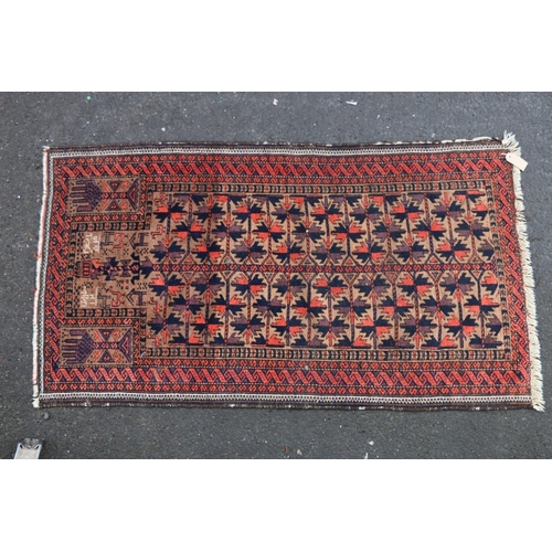 703 - Baluch Persian/Afghan rug, the geometric stylised Tree of Life central pattern within multiple borde... 