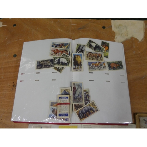 66 - Album of mixed cards and cigarette cards.