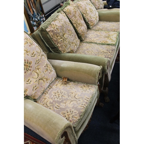 693 - Early 20th century walnut framed suite, the upholstered cushions and stuffed seats on an acanthus sc... 