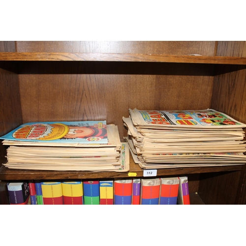 312 - Shelf containing Beano magazines.