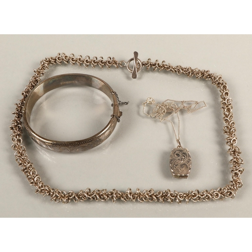 65 - Silver bangle Birmingham 1963, locket Birmingham 1973, and T-bar necklace marked 925, gross weight 7... 