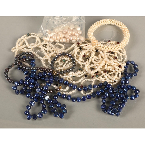 99 - Pearl necklaces in assorted colours, white, blue, black, and some loose