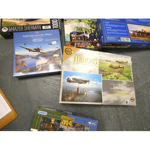 71 - Various new and used, military related jigsaws.