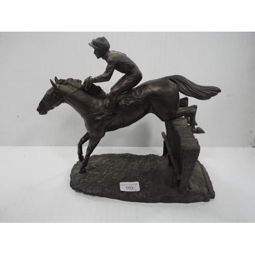 102 - Two contemporary figure groups modelled as a jockey and rider, one example by Heredities. 