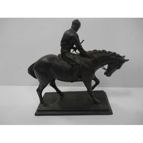 102 - Two contemporary figure groups modelled as a jockey and rider, one example by Heredities. 