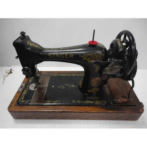 110 - Singer portable sewing machine in fitted case.