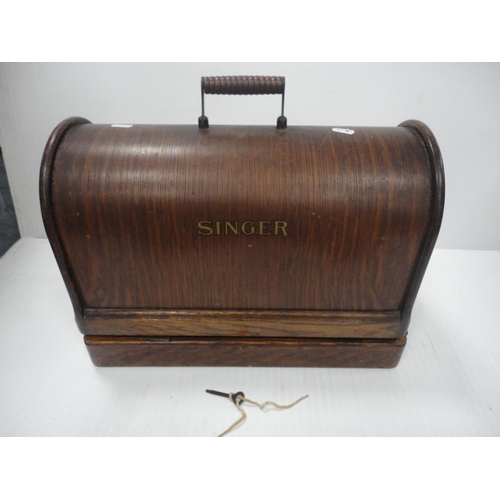 110 - Singer portable sewing machine in fitted case.