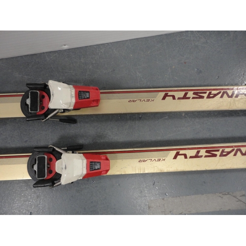 116 - Pair of Kastle skis and a pair of Dynastar Kevlar skis.