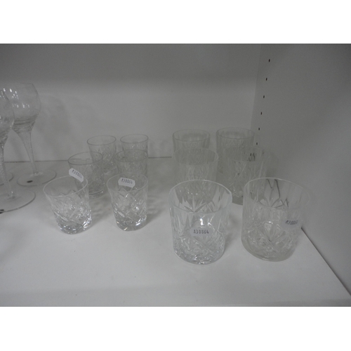 123 - Glassware to include a faceted crystal serving tray, two decanters, brandy glasses, Babycham glasses... 