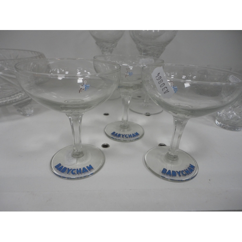 123 - Glassware to include a faceted crystal serving tray, two decanters, brandy glasses, Babycham glasses... 