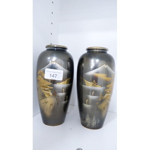 147 - Pair of Japanese metal overlaid vases and three Oriental blanc de chine figures (one shelf).  (5)